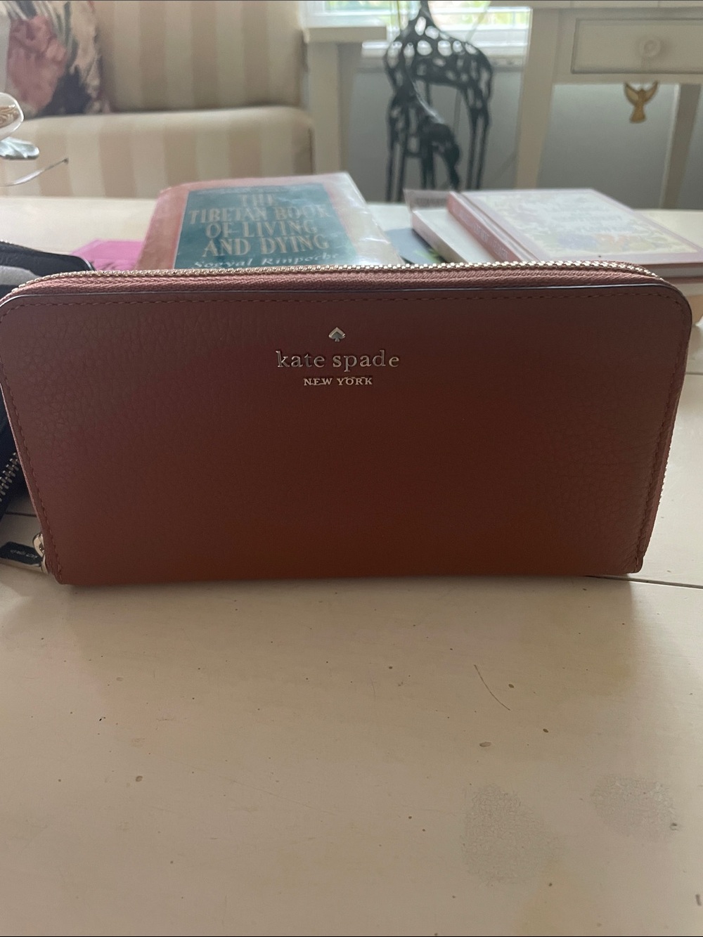 kate spade zip-around wallet in rust brown with gold logo